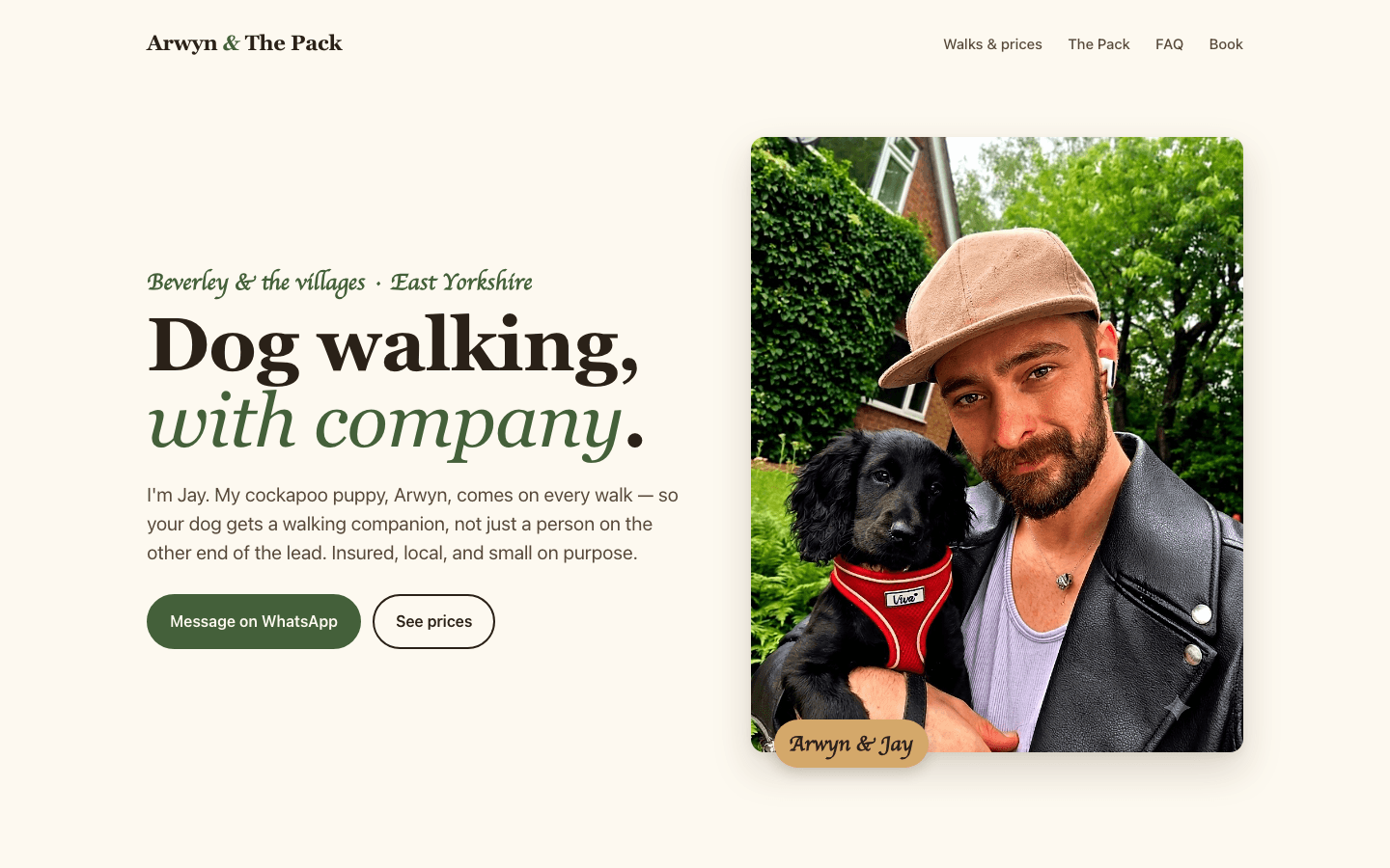The Arwyn & The Pack homepage: a Beverley dog-walking service on warm cream, with a photograph of Jay holding Arwyn, his black cockapoo puppy, beside the booking buttons.